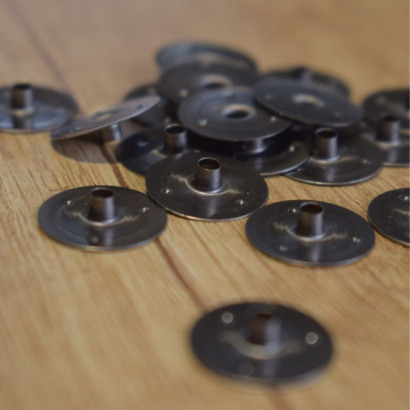 Metal baseplate for candle wick